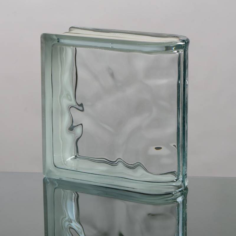 Bloque de vidrio transparente terminación curva.